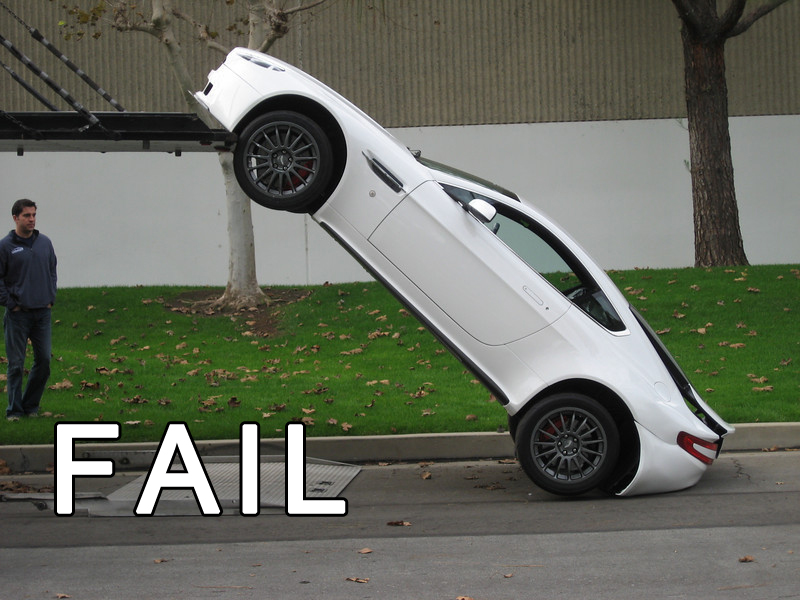 Illustration for article titled This Is Not The Proper Way To Unload An Aston Martin